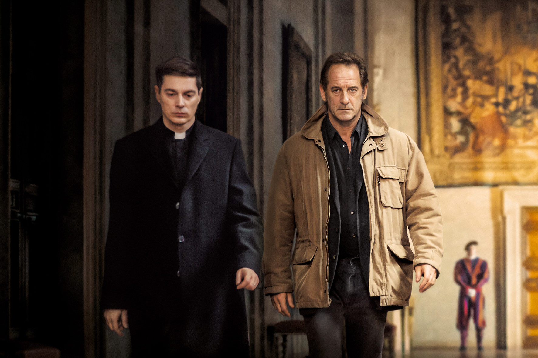 Vincent Lindon and a priest in The Apparition